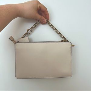 White coach clutch with gold chain handle